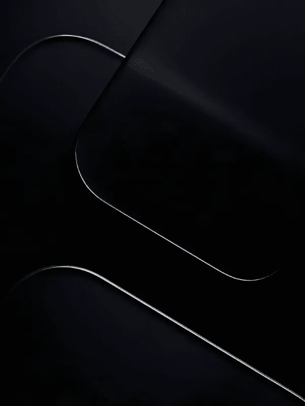 Near-black panels layered at an angle, each rounded edge traced by a thin bright seam where it catches the light